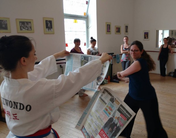 Atisheh cutting paper with korean sword